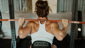 Tia Clair-Toomey squatting with barbell