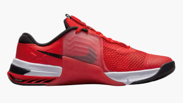 Nike Metcon 7 - Men's - Chile Red / Magic Ember / White / Black side view on white background
